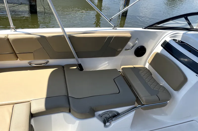 Slide: The Image of 2025 Bayliner VR6 Bowrider OB interior with beige seating and sleek design. - 5
