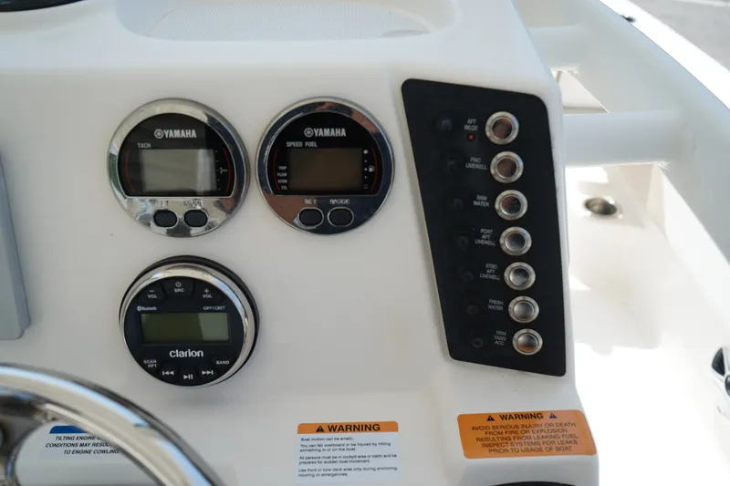 Slide: The Image of Control panel of a 2019 Robalo 246 Cayman boat with Yamaha gauges and Clarion audio system. - 16