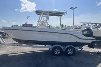 Slide: The Image of 2023 Trophy T22 boat on trailer, parked outdoors under a clear sky. - 5