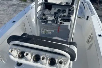 Slide: The Image of 2023 Trophy T22 boat interior with steering console and rod holders. - 8
