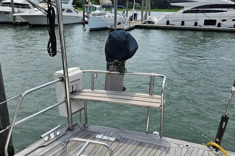 Slide: The Image of Stern view of 1999 Farr Pilothouse 50 yacht docked at marina. - 27