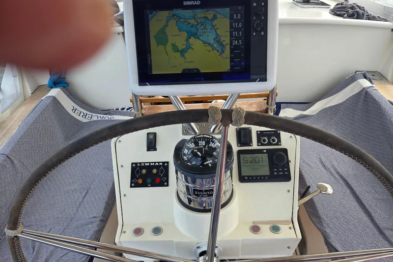 Slide: The Image of Helm of 1999 Farr Pilothouse 50 sailboat with navigation instruments and steering wheel. - 18
