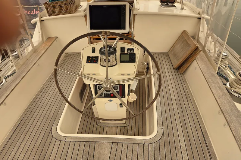 Slide: The Image of Pilothouse of 1999 Farr Pilothouse 50 yacht with steering wheel and navigation equipment. - 17