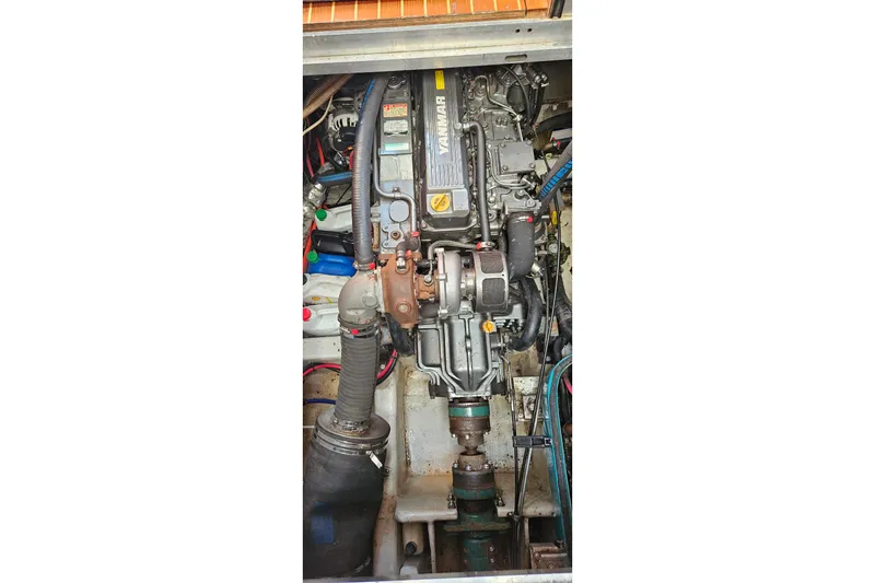 Slide: The Image of Engine compartment of a 1999 Farr Pilothouse 50 sailboat, featuring a Yanmar engine. - 20