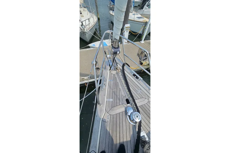 Slide: The Image of Bow view of 1999 Farr Pilothouse 50 sailboat docked at marina. - 21