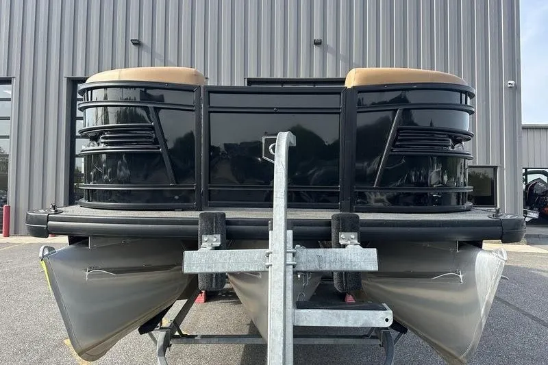 Slide: The Image of 2024 AquaPatio 235 UL pontoon boat on trailer, parked outside a building. - 13
