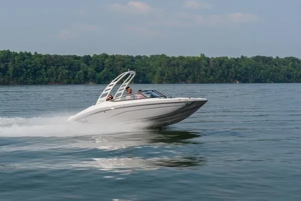 Slide: The Image of 2026 Yamaha Boats 195S speeding on a lake with lush green forest backdrop. - 7
