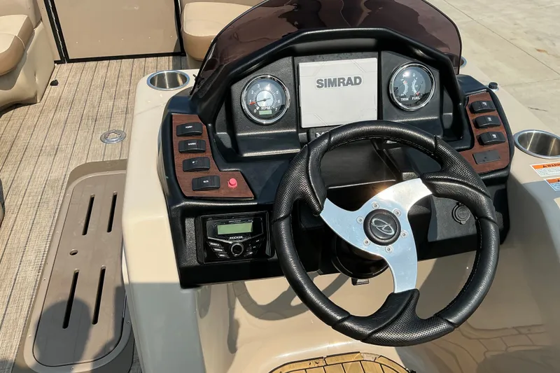 Slide: The Image of Steering console of 2022 Veranda Relax VR22RC boat with Simrad display and gauges. - 16