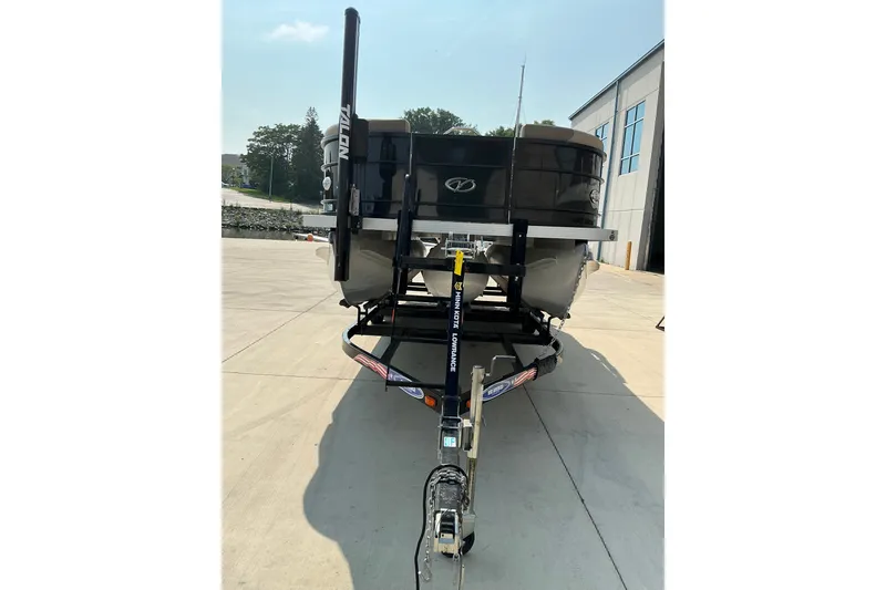 Slide: The Image of 2022 Veranda Relax VR22RC pontoon boat on trailer, parked outdoors. - 9