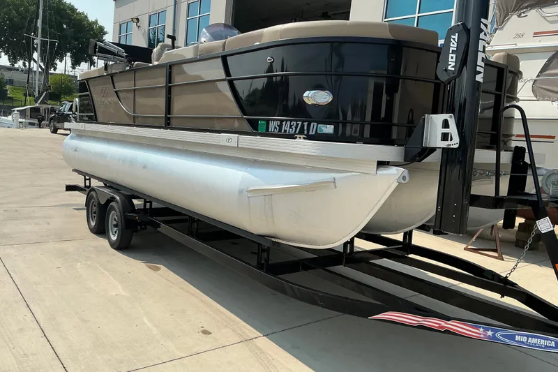 Slide: The Image of 2022 Veranda Relax VR22RC pontoon boat on trailer at marina. - 10