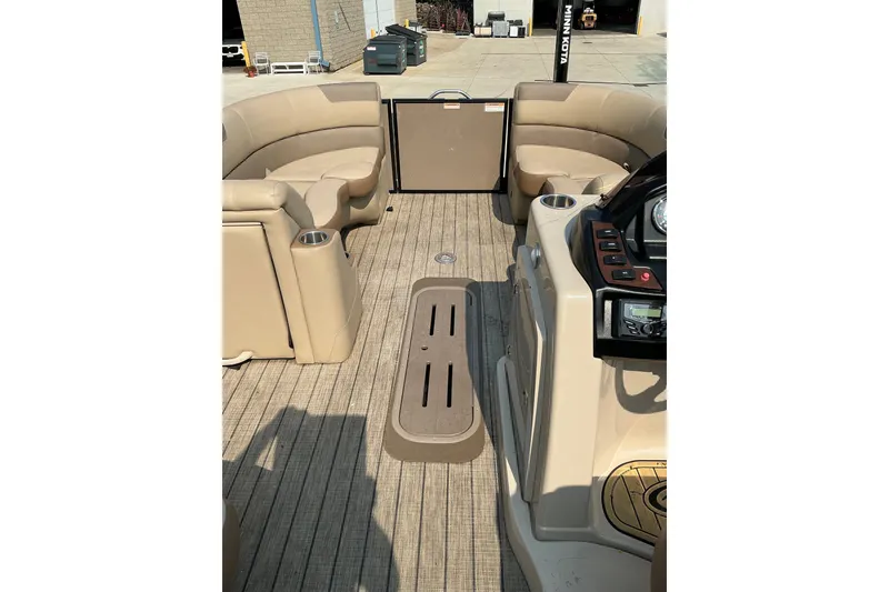 Slide: The Image of 2022 Veranda Relax VR22RC pontoon boat interior with beige seating and wood-style flooring. - 18