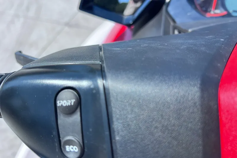 Slide: The Image of Close-up of 2012 Sea-Doo Wake 155 handlebar with sport and eco mode buttons. - 15