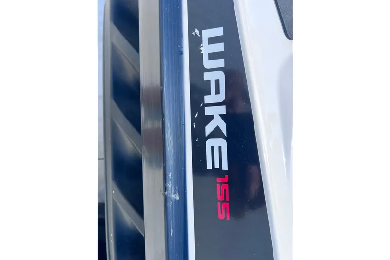 Slide: The Image of Close-up of 2012 Sea-Doo Wake 155 logo on watercraft body. - 19