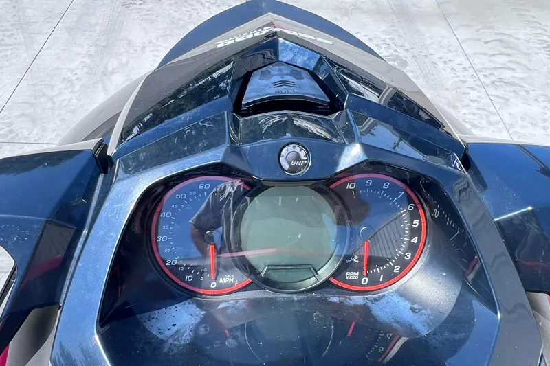 Slide: The Image of Dashboard of a 2012 Sea-Doo Wake 155 jet ski, showing speedometer and tachometer. - 16