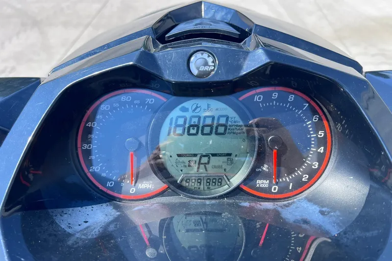 Slide: The Image of Close-up of 2012 Sea-Doo Wake 155 dashboard displaying speedometer and tachometer. - 18