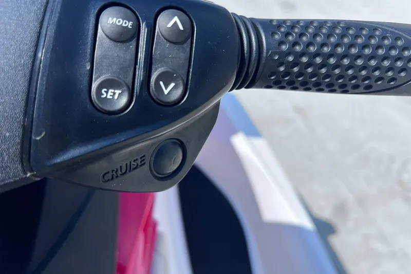 Slide: The Image of Close-up of 2012 Sea-Doo Wake 155 handlebar controls with cruise mode buttons. - 14