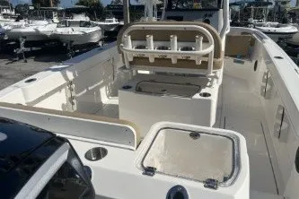 Slide: The Image of 2024 Trophy T24 CC boat interior with seating and storage compartments. - 7