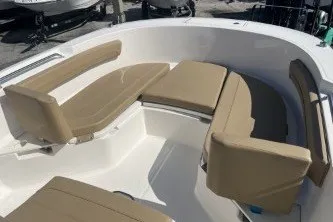 Slide: The Image of 2024 Trophy T24 CC boat interior with beige seating and spacious layout. - 10