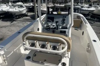 Slide: The Image of 2024 Trophy T24 CC boat interior with steering console and rod holders. - 8