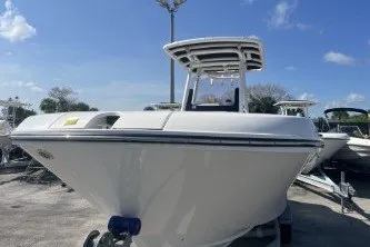 Slide: The Image of 2024 Trophy T24 CC boat with sleek design under a clear blue sky. - 3