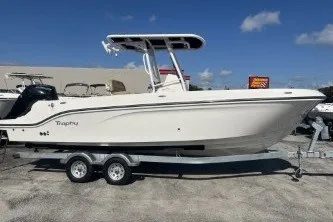 The Image of 2024 Trophy T24 CC boat on trailer under clear blue sky. - 1