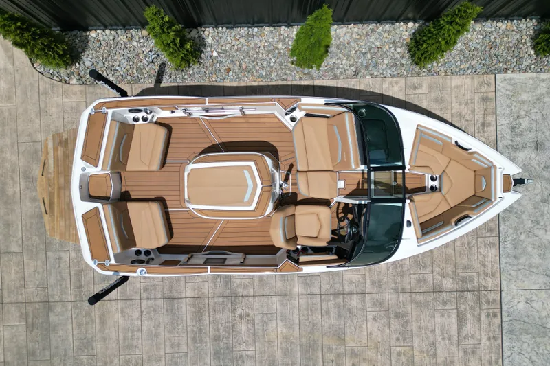 Slide: The Image of 2023 MasterCraft ProStar boat, aerial view, showcasing sleek design and spacious seating. - 18