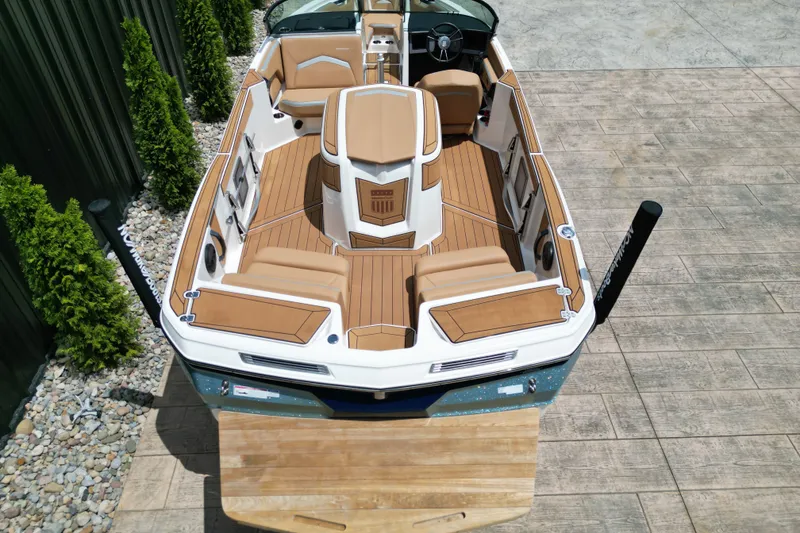 Slide: The Image of 2023 MasterCraft ProStar boat with tan seating and sleek interior design. - 16