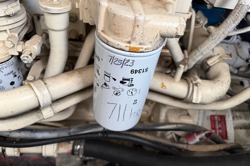 Slide: The Image of Engine filter of a 1997 Trojan 440 Express with maintenance date and hours noted. - 43