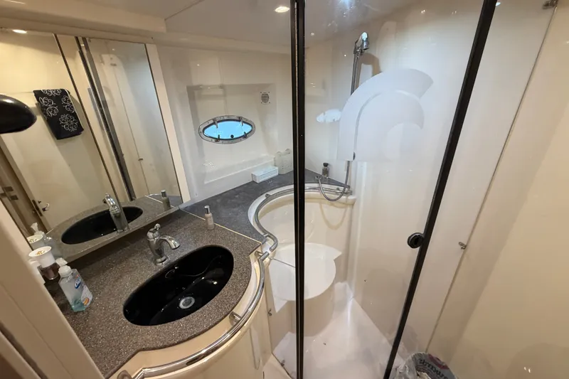 Slide: The Image of Bathroom interior of 1997 Trojan 440 Express yacht with modern fixtures and shower. - 35