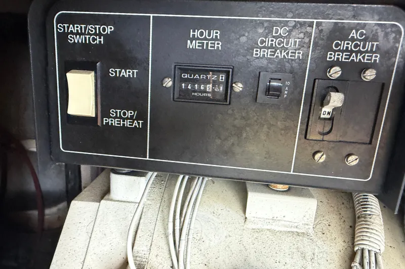 Slide: The Image of Control panel of a 1997 Trojan 440 Express with start switch and circuit breakers. - 48