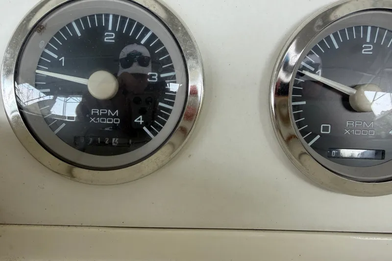 Slide: The Image of Close-up of RPM gauges on a 1997 Trojan 440 Express boat dashboard. - 39
