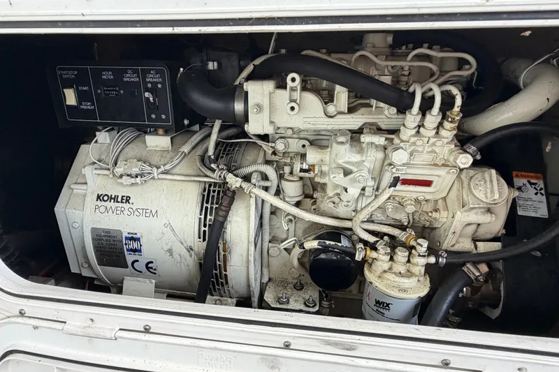 Slide: The Image of Engine compartment of a 1997 Trojan 440 Express with Kohler power system. - 47