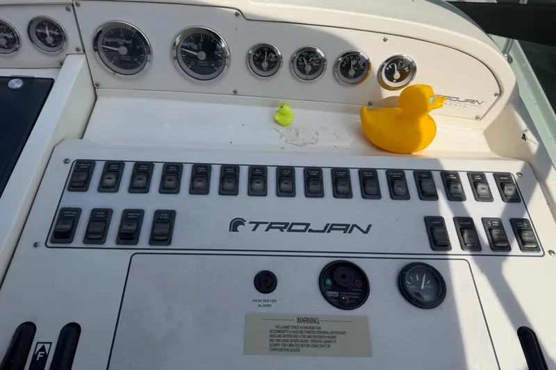 Slide: The Image of Control panel of a 1997 Trojan 440 Express yacht with rubber ducks. - 14