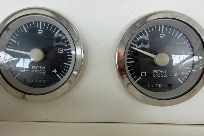 Slide: The Image of Close-up of RPM gauges on a 1997 Trojan 440 Express boat dashboard. - 38