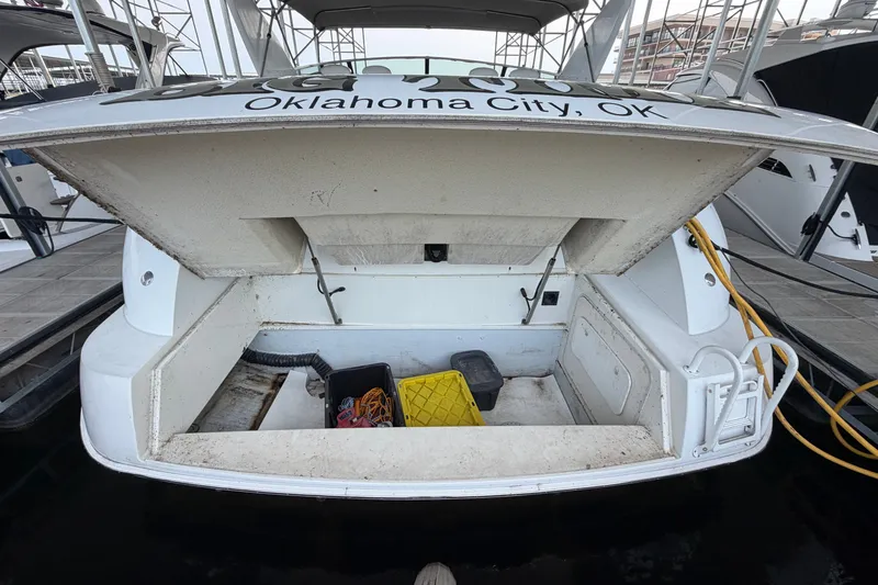Slide: The Image of 1997 Trojan 440 Express boat storage compartment, Oklahoma City, docked with equipment inside. - 46