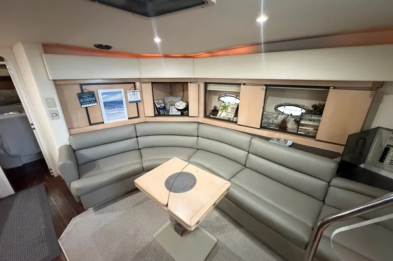 Slide: The Image of Luxurious interior of 1997 Trojan 440 Express yacht with plush seating and elegant decor. - 23