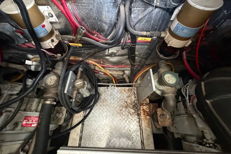 Slide: The Image of Engine compartment of a 1997 Trojan 440 Express with visible wiring and components. - 45