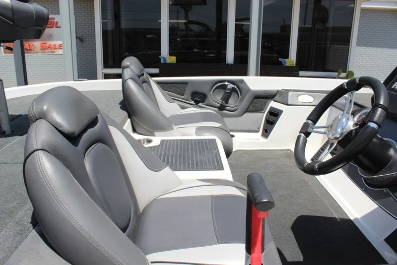 Slide: The Image of 2017 Ranger Z519 boat interior with dual seats and steering wheel. - 17