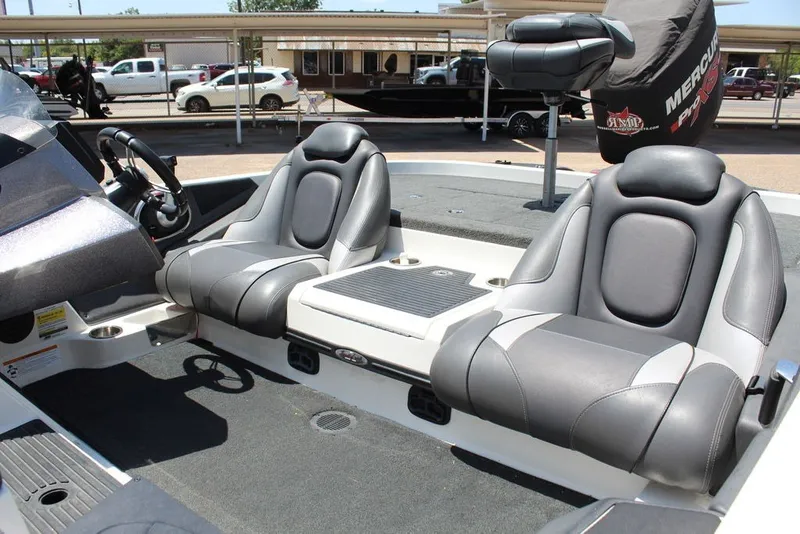 Slide: The Image of 2017 Ranger Z519 boat interior with dual gray seats and steering wheel. - 19