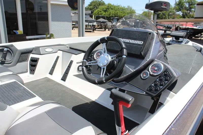 Slide: The Image of 2017 Ranger Z519 boat interior with steering wheel and control panel. - 15