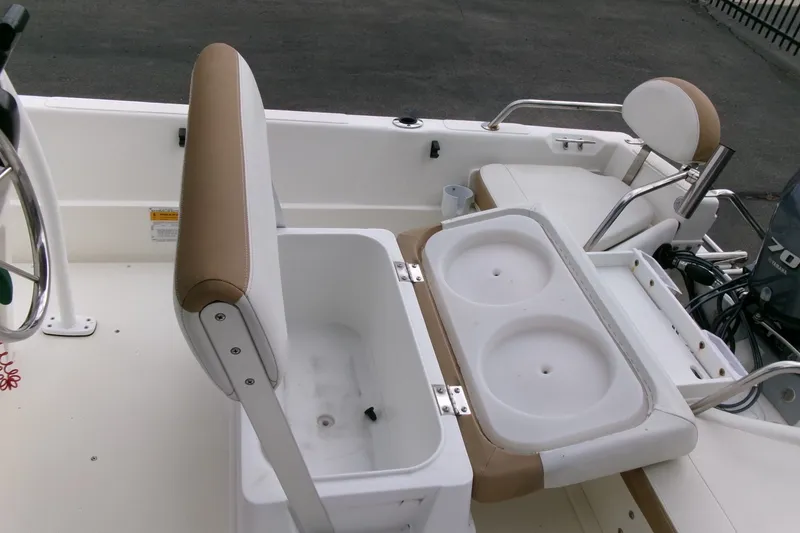 Slide: The Image of 2014 Triumph 170 CC boat interior with seating and storage compartments. - 15