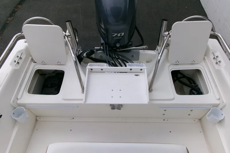 Slide: The Image of 2014 Triumph 170 CC boat interior with Yamaha 70 engine, featuring storage compartments. - 18