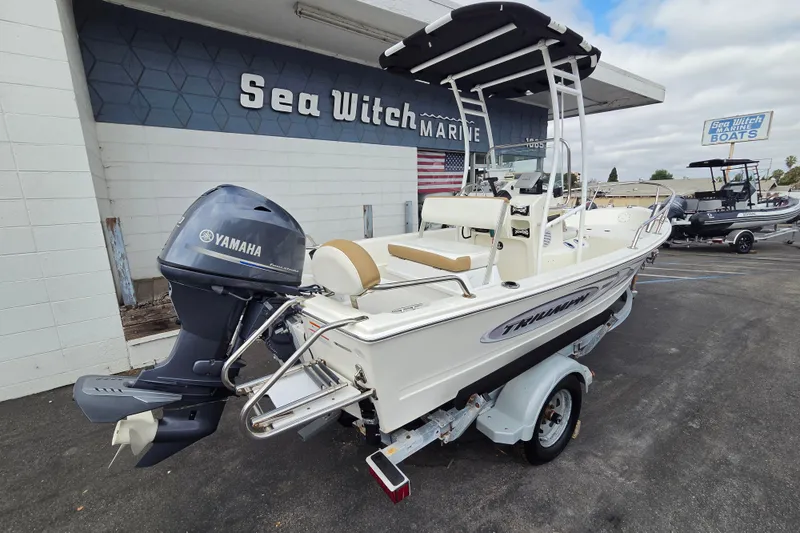 Slide: The Image of 2014 Triumph 170 CC boat with Yamaha outboard motor at Sea Witch Marine dealership. - 2
