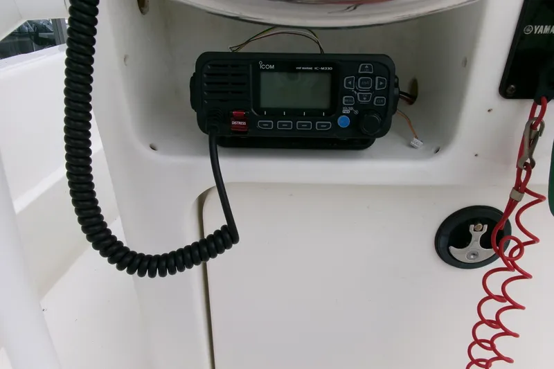 Slide: The Image of VHF marine radio on 2014 Triumph 170 CC boat dashboard. - 11