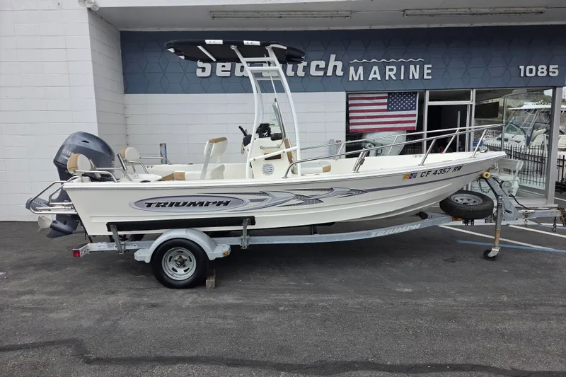 The Image of 2014 Triumph 170 CC boat on trailer at dealership, Sea Witch Marine. - 0
