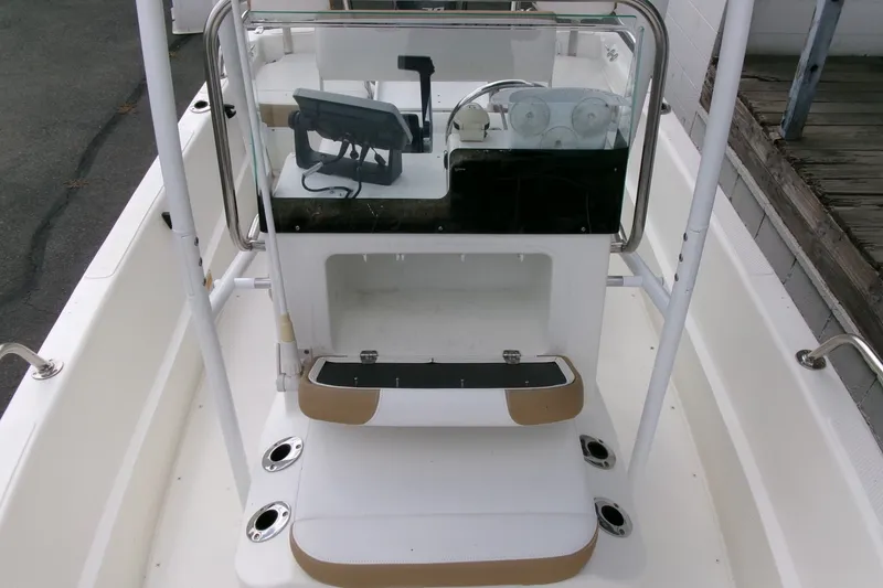 Slide: The Image of 2014 Triumph 170 CC boat interior with steering console and seating area. - 7