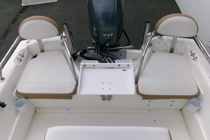 Slide: The Image of 2014 Triumph 170 CC boat interior with dual seating and Yamaha outboard motor. - 16