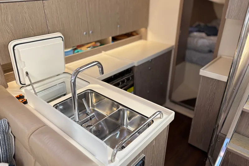 Slide: The Image of Modern kitchen interior of 2018 Hanse 455 yacht with stainless steel sink. - 24