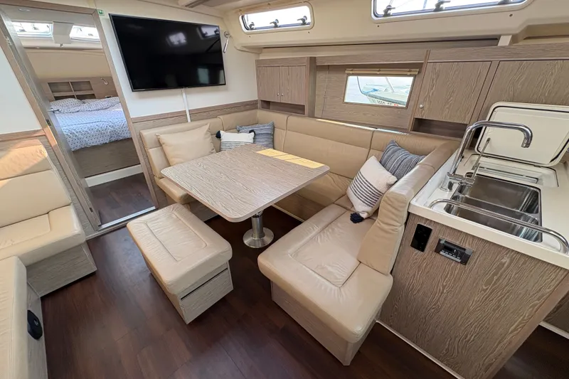 Slide: The Image of Luxurious interior of 2018 Hanse 455 yacht with modern seating and kitchenette. - 22