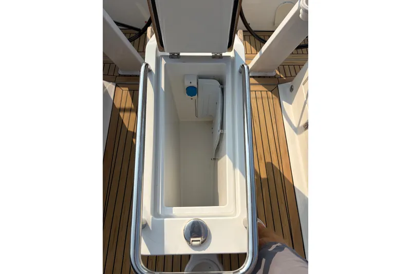 Slide: The Image of Open storage compartment on 2018 Hanse 455 yacht with teak flooring. - 17